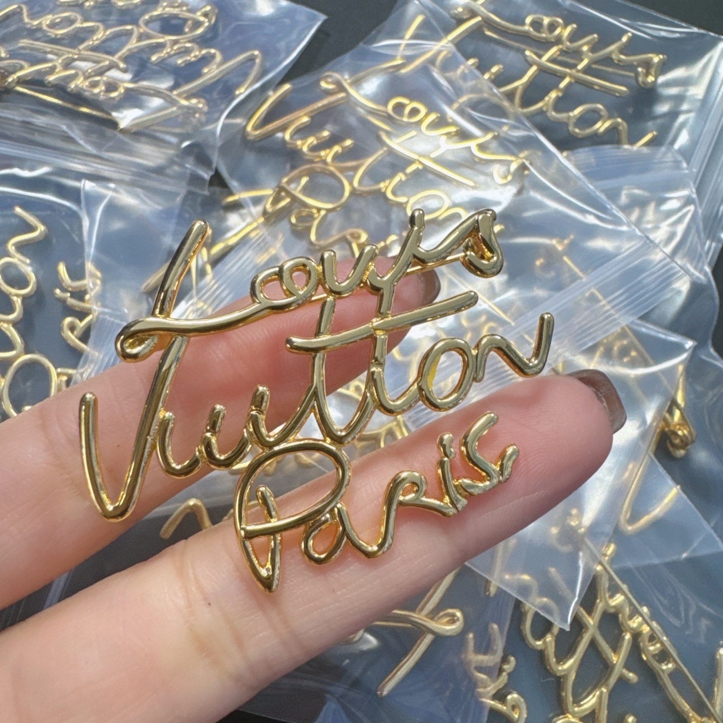 Image 14 Gold Mono Logo Brooch - Image 1